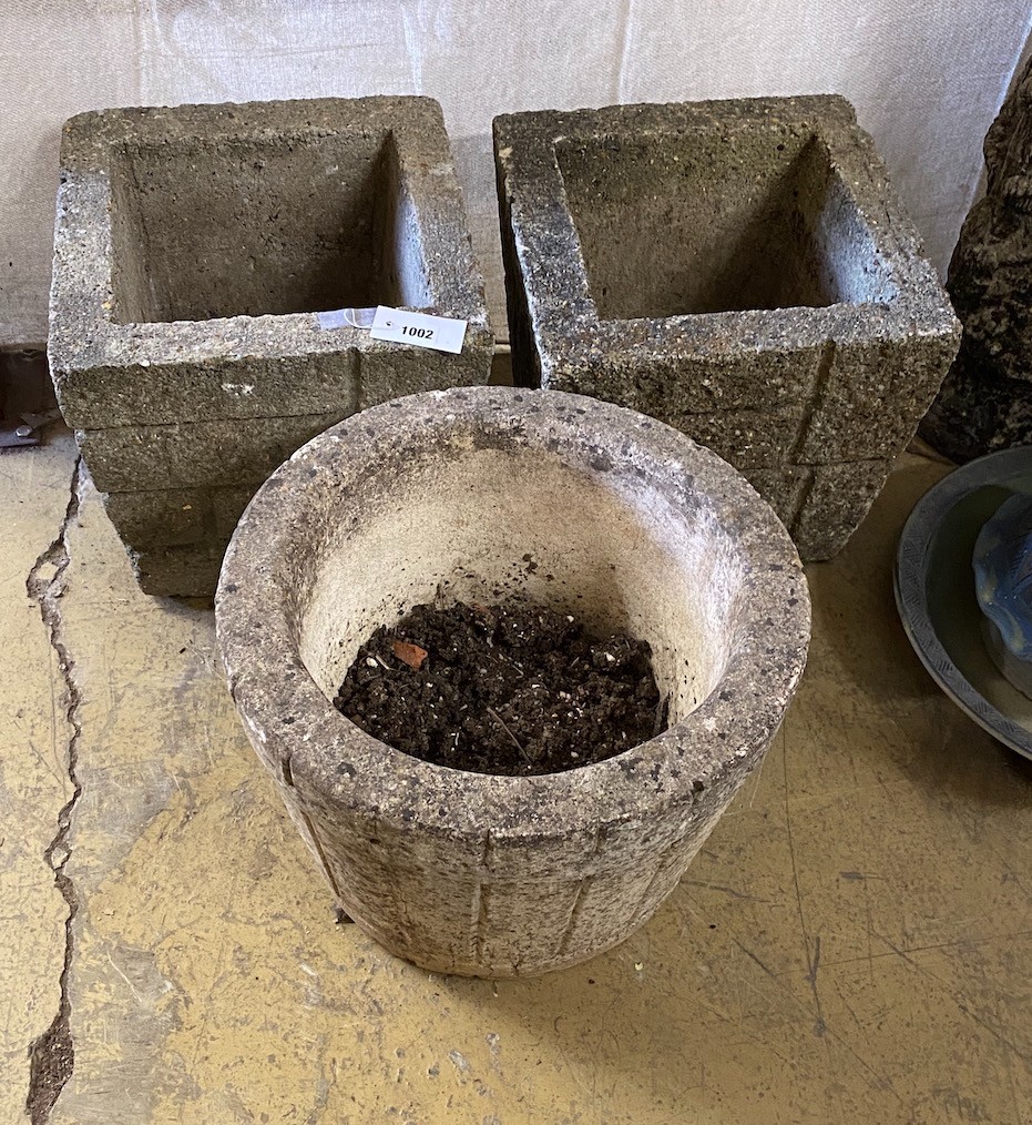 A pair of reconstituted stone 'brick' square garden planters, width 33cm, height 30cm together with a similar circular garden planter